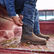 Cowboy on truck bed pulling on DDB0366 Maverick XP work boot